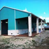 Barndominium This is a beautiful 30x60 with a 15x60 covered patio. Stained floors inside and out. Has 1 bedroom and 2 bathrooms downstairs with a kitc