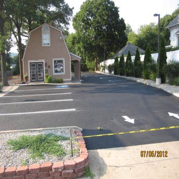 Project photos from Back To Black Sealcoating LLC The First picture is a driveway that was done 3 days prior to taking the picture.. The second picture