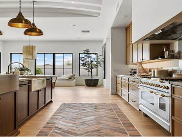Photos by Herringbone Development #1 Modernized kitchen. Design layout was changed. Fully custom cabinetry. State of the art appliances. High-end kitch