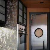 NW Glisan This sleek Pearl District has a kitchen with all the bells and whistles, including a built-in breakfast nook, a pantry with a porthole door a