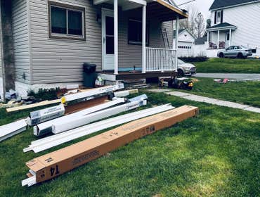 Photos by Reaper Junk Removal Services #4 Add additional porch with new roof,supports,trex decking and vinyl railings to match.