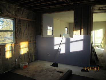Installing drywall at trailer