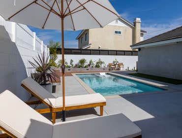 Willow Pool & Deck & BBQ Remodel Admire our completed backyard project featuring a sleek pool, comfortable lounging area, and stylish landscaping, perf