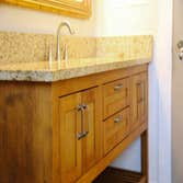 Spalinger Vanity The clients requested a custom vanity for their bathroom remodel, which would not accommodate a standard vanity. They wanted a furnitu
