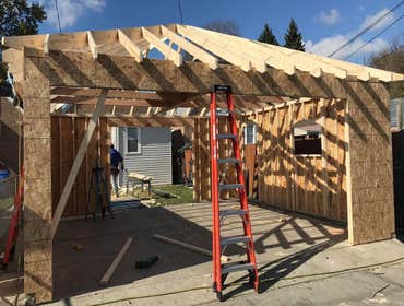 Photos by A-Windy City Garage Corporation #6 New garage construction hip roof with hardie siding and upgraded garage doors.