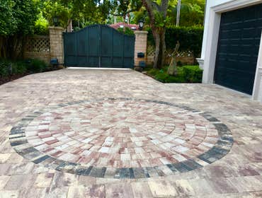 Driveway and Courtyard redesign. Driveway redesign: The timeless elegance and craftsmanship of the Mega Olde Towne pavers by Tremron on driveway and co