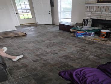 Rowlett, Texas Demo 1000 sq ft of carpet and vinyl plank floor and installation of 1000 sq ft of ceramic tile. Painted interior walls. Design and insta