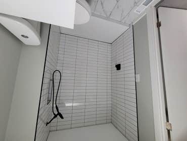 Photos by Blacks Enterprizes LLC #1 simple bathroom nothing too extravagant except for the stack Subway tile. The bathroom came out clean the client is