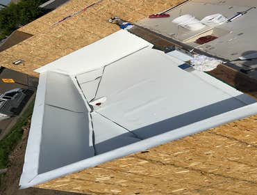 TPO installation with walls and crickets