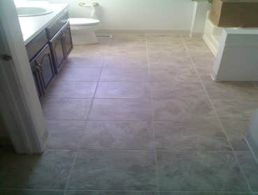 Tile & Hardwood In this project the customer went with a product called Duraceramic. Toilets were removed and reinstalled in both bathrooms. Downstairs