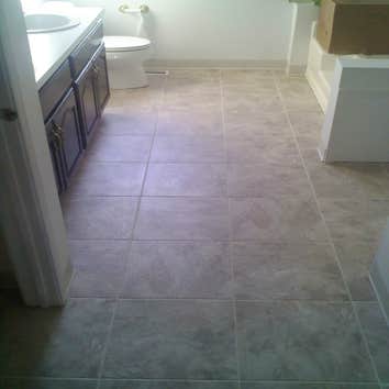 Tile & Hardwood In this project the customer went with a product called Duraceramic. Toilets were removed and reinstalled in both bathrooms. Downstairs