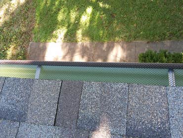 New gutters with leaf screens