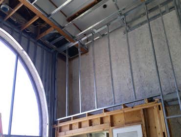 Photo(s) from T And C Drywall This is an apartment main office building.
-Furred out cement walls
-drywall
-texture