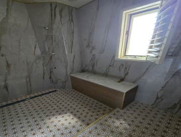 Photos by MC ALISTER TILE #1 5 showers total, was hired after another handyman did not water proof correctly, fixed all water proofing and installed 