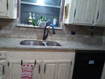 Rustic Kitchen RESIDENTIAL Kitchen.
Granite Countertops
Natural Stone Backsplash
W/Drop In Sink