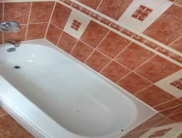 Photos by Tdv Construction #1 Lay ceramic tile flooring and tile tub surround