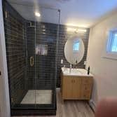 Photos by Kennison Construction LLC #2 Remodeled 1st floor. Demo old bathroom and remodeled it to a master bathroom with a separate powder room