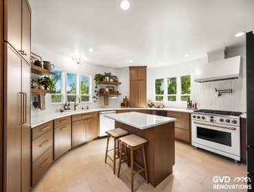 Custom Curved Kitchen Remodel This Fair Oaks kitchen remodel transformed a dated curved layout into a warm, modern space with custom cabinetry, quartz 