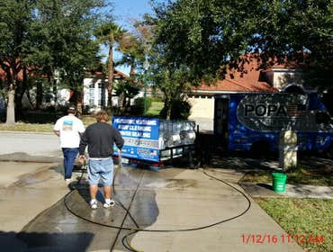 Photos from Popa Construction LLC Before & Afters of a soft wash roof cleaning and driveway and side walk cleaning.