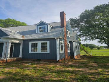 Photos by Porterhouse Remodeling #2 We renovated an old farmhouse with new energy star certified windows and insulated Certainteed Vinyl Siding.