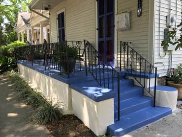 Painting on concrete porch and metal handrails