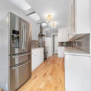 Renovated kitchen with stainless steel appliances and white cabinetryRenovated kitchen with stainless steel appliances & white cabinetry