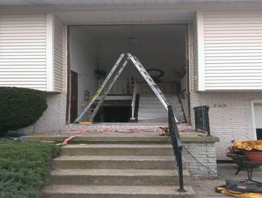 Front Door Entry with Transom Remove old door and transom window; Install new door with side lights, new storm door and new transom window.