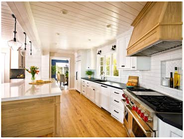 Open Concept Kitchen We eliminated walls separating the kitchen from the dining area. The kitchen strikes a dramatic balance between light and dark, an