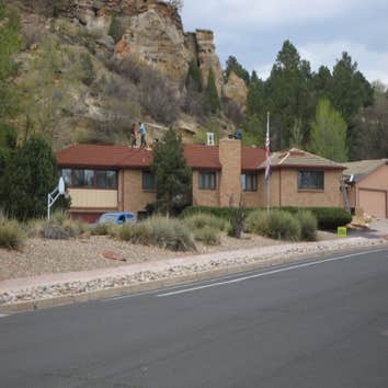 The Jones Residence Full roof replacement with a stone-coated metal product as a superb tile replica.