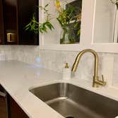 Kitchen Reno Before and After in Bergen County Demo of bar top wall and reframing, new counters, backsplash and plumbing hookups