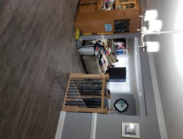 Photos by Magnum Home Services LLC #15 New Laminate Flooring Throughout, New Custom Railings and Balusters, New Baseboard , Crown Molding and Chair Rai