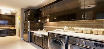 Laundry Room Reinvented This mom of young twin boys needed a functional laundry and drop off area when entering their home from the garage. The origina