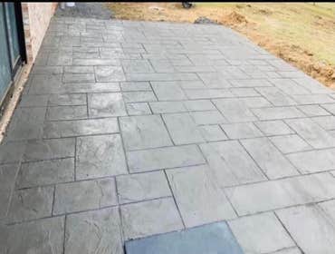 Stamped backyard concrete pad