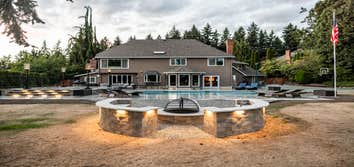 Woodinville, King County Pool and porcelain paver patio with fire pit and Low voltage lighting.