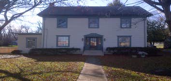 Exterior Restoration, Preservation and Painting Project had rooted wood at down spouts, replaced rooted wood and restored shutters and painted under bu