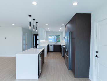 Galley-Style Open Concept Kitchen with an Island