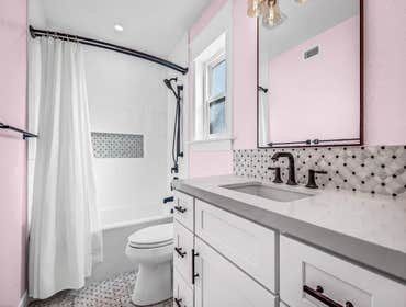 Photos by Golden Shore Design and Build #3 Tub to tub bathroom remodel
Semi custom white vanity, shaker style.
A matching floor, backsplash and soap n