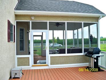 A Stucco Sunroom We built a sun-room integrated into a deck for this specific customer.