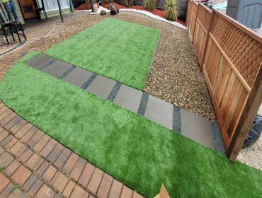 Photos by Landscaping La Economica LLC #1 Installed artificial turf, paver stone walkway, decorative mulch, and a new wooden fence. This project provid