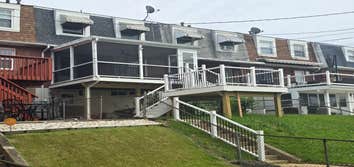 Photos by Bowman Construction LLC #3 Two tier vinyl/pvc deck & porch enclosure