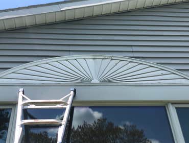 Photos by Crosscut Construction LLC #3 Seal/Caulk and paint starburst above window