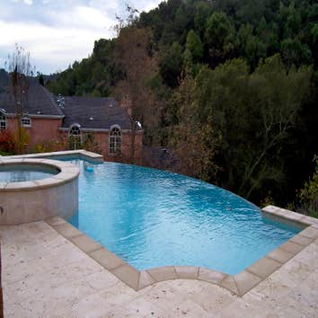 Alta American Pools Inc Project Downhill side of infinity edge pool. 1"x1" glass tiles set in a mosaic pattern