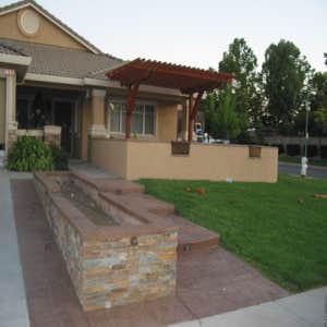 Project photos from Albertazzi Construction Inc Stamped concrete and patio cover, raised planter with rock edge