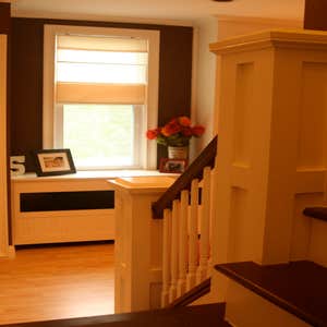 Shaughnessy Custom Trimwork- columns and Beadboard. Built in bookshelves, radiator covers and entertainment area.