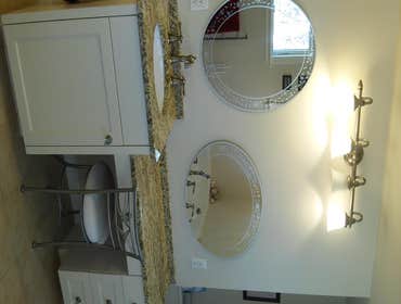Bathroom Remodel South Dennis MA Renovation of master bathroom, separate vanities, and jetted tub, walk in shower
