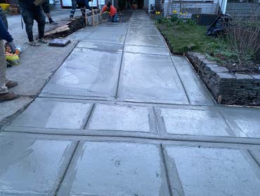 Photos by NW Regal Construction LLC #1 Driveway, retaining wall, and city sidwalk