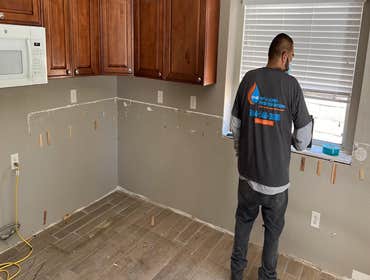 Drywall Flood cuts in water damaged kitchen in Upland