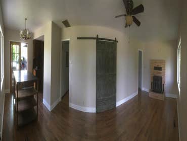 Stockton, Ca Removal of wood paneling and installation of new baseboard, trim, sliding patio door, and barn door.