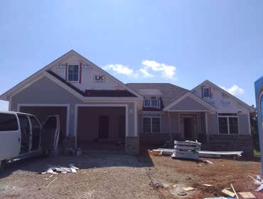Photos by A-earlybirds #3 Asphalt shingle installation on the doghouse located in the front section of the house and over the garage..