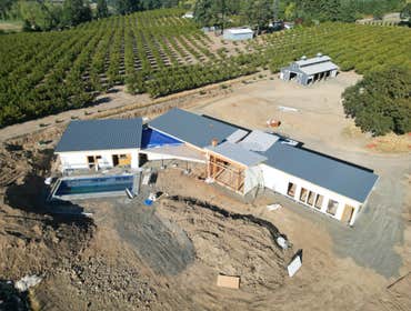 Photos by Aspire Homes Inc #3 Custom home with roof insulation, exterior insulation, solar, geothermal and pool.